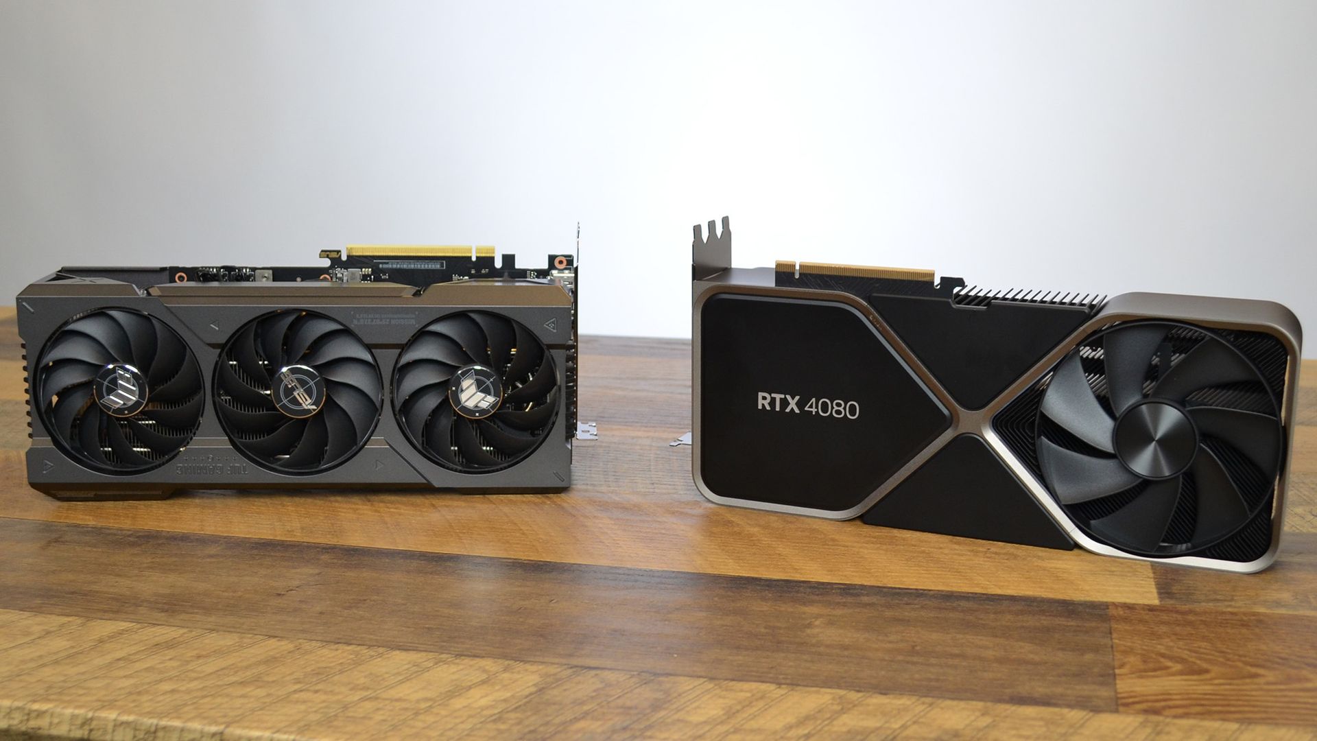 High-end GeForce RTX graphics cards with large cooling fans displayed on a bright background