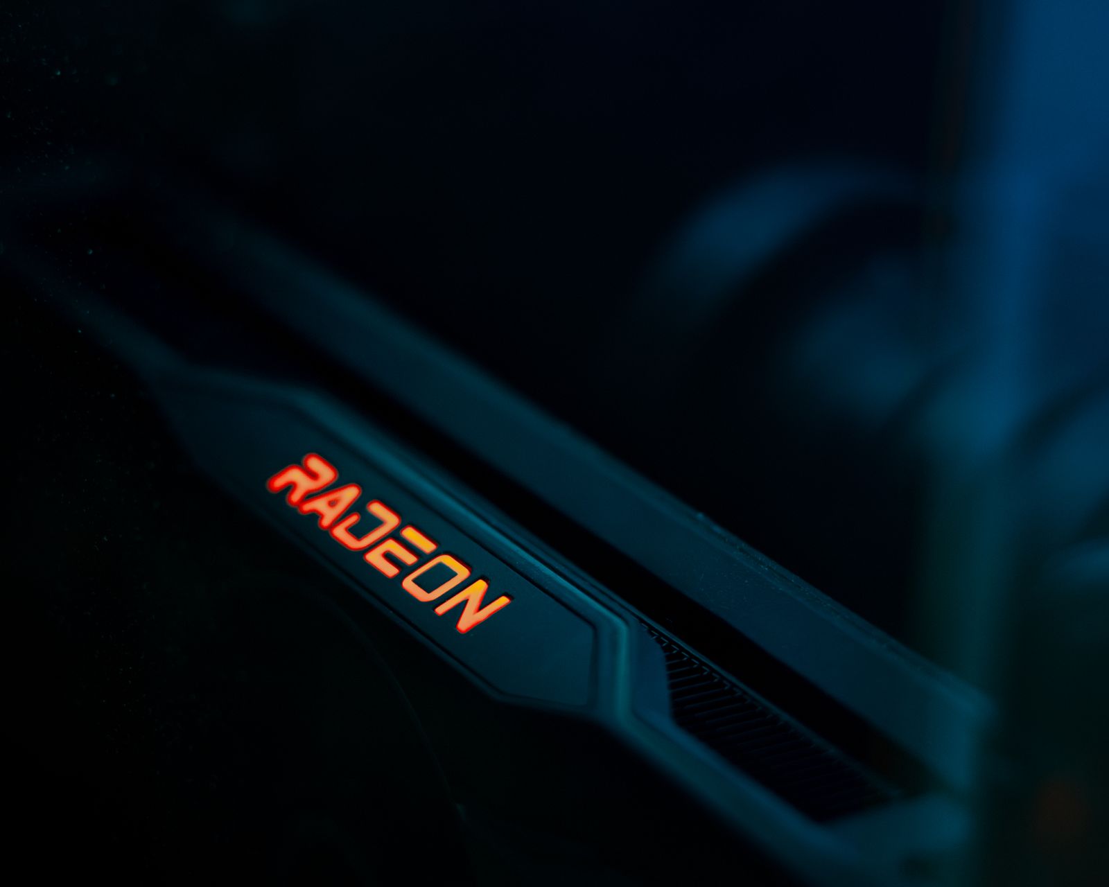 Radeon graphics card glowing under blue light