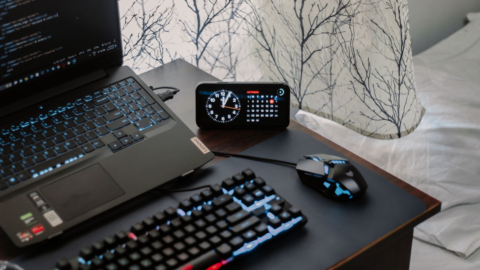 Desk with laptop, gaming mouse, and keyboard