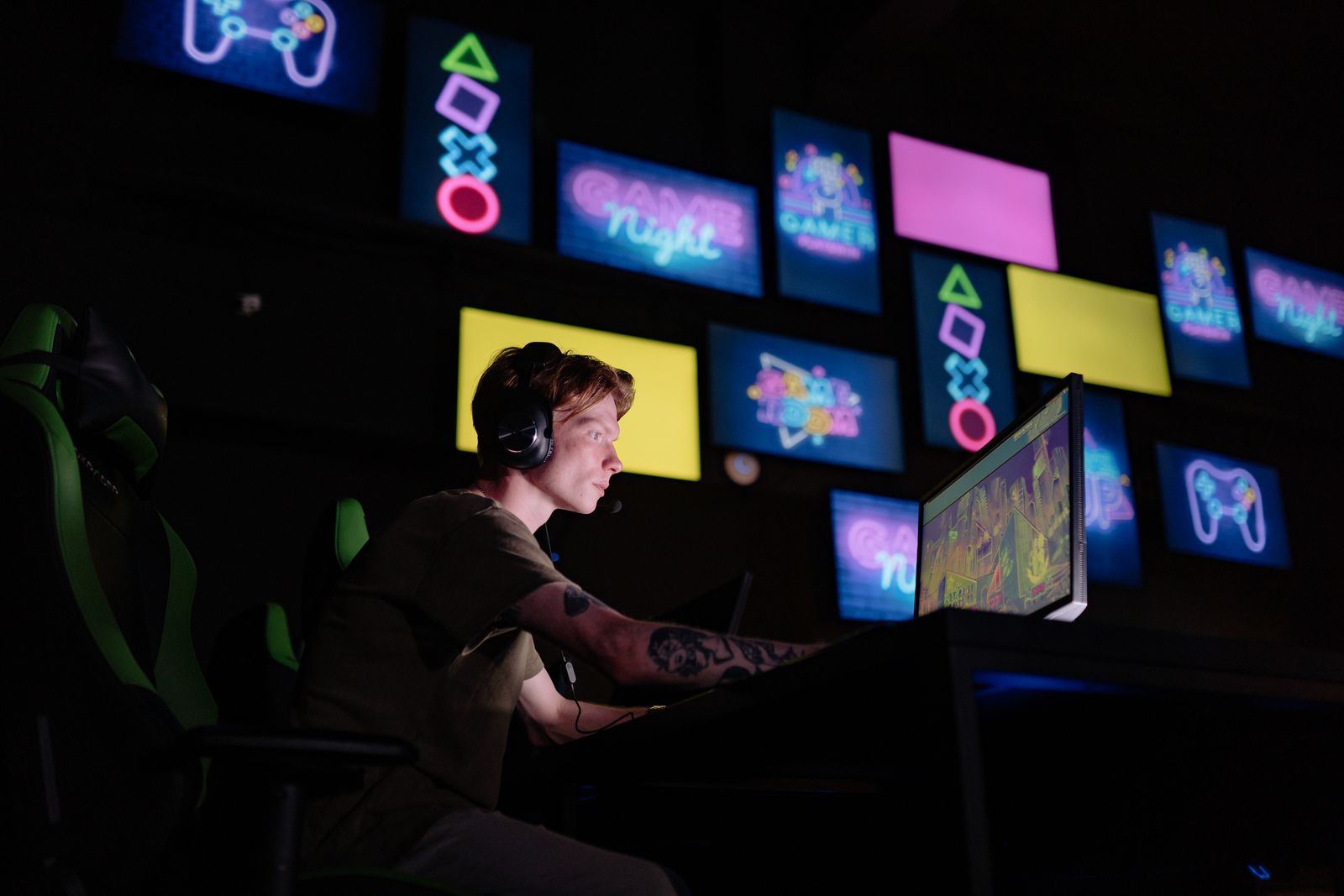 Focused gamer playing esports in a neon-lit room