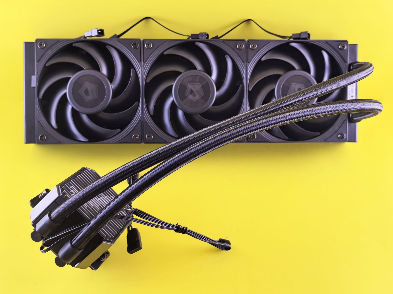 Computer cooling system with three fans on yellow background