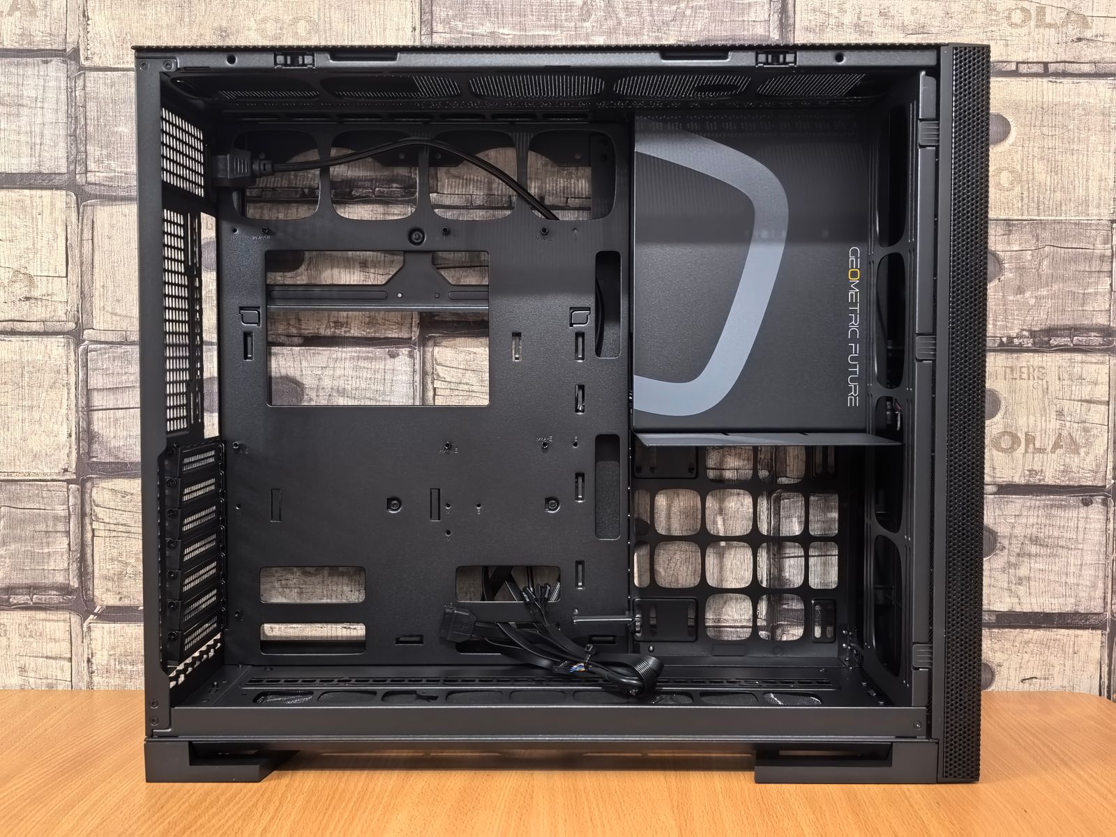 Open black computer case with geometric design