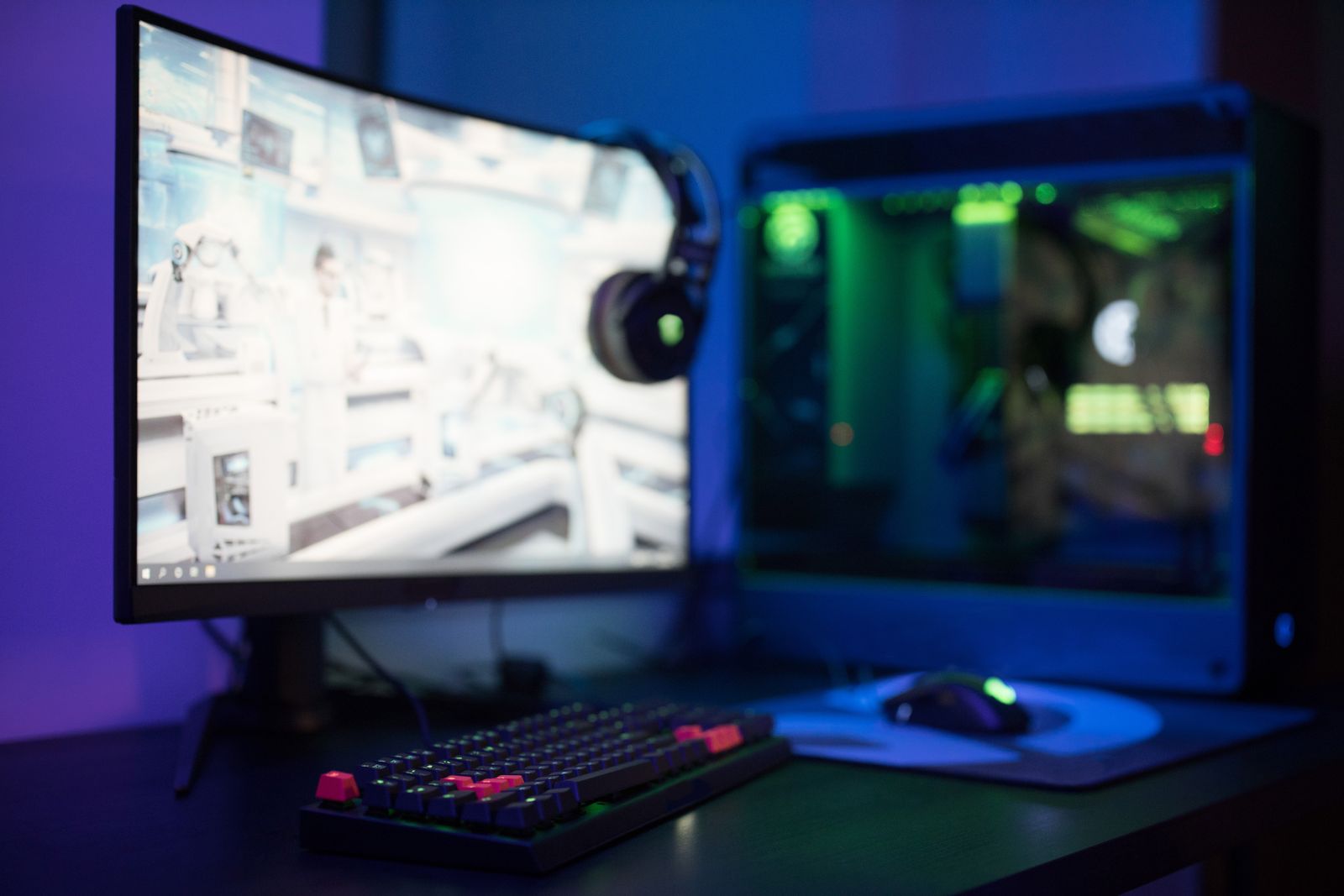 Gaming setup with curved monitor and RGB keyboard
