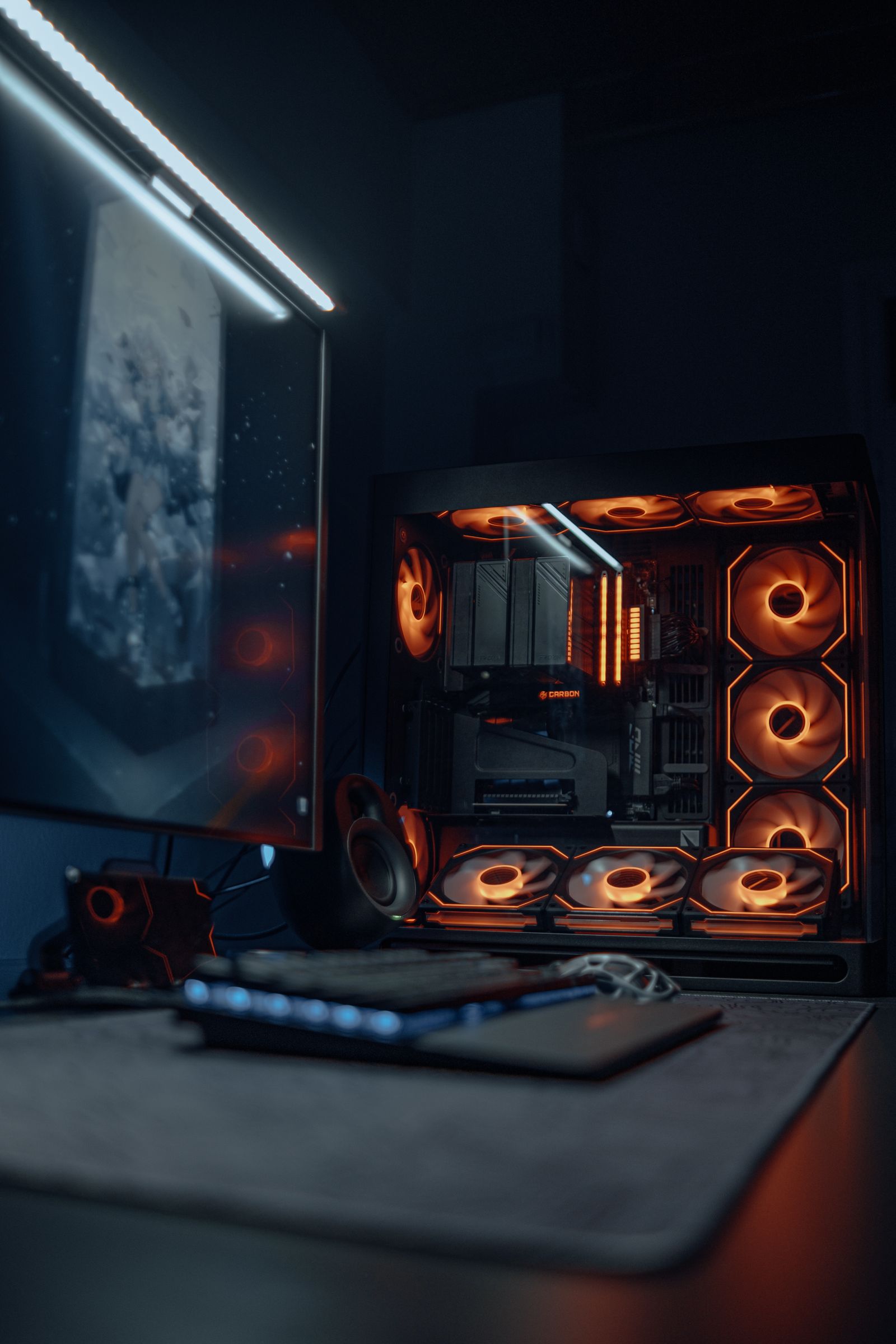 RGB gaming PC setup with monitor, headset, and case fans lit up
