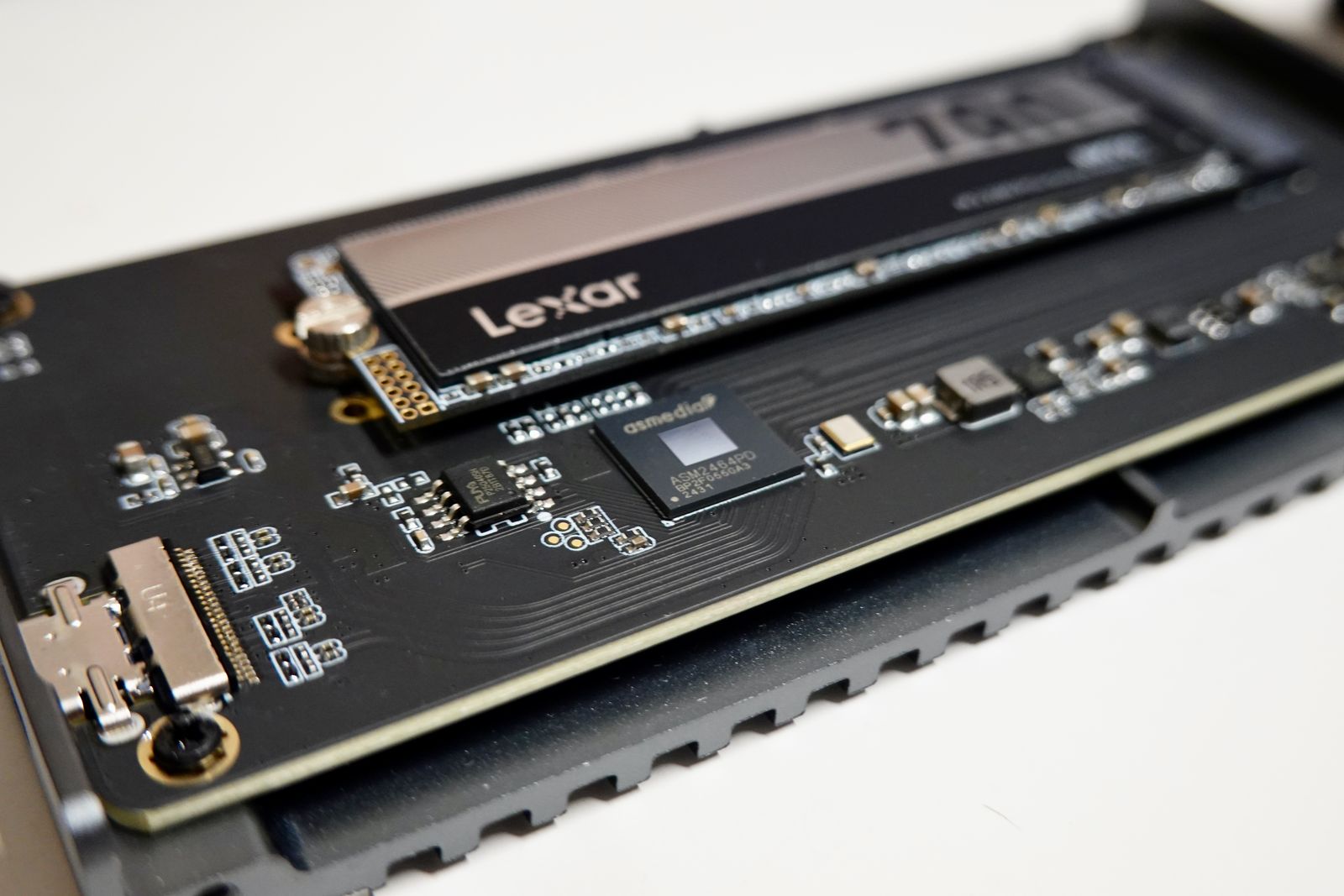 Close-up of an NVMe SSD circuit board and controller chip